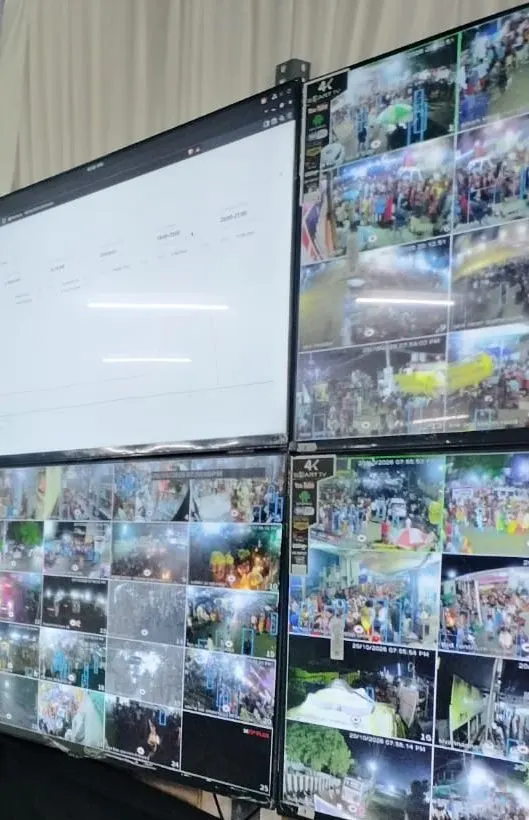 Video wall tiles showing dense festival crowds across temple, beach and procession route feeds